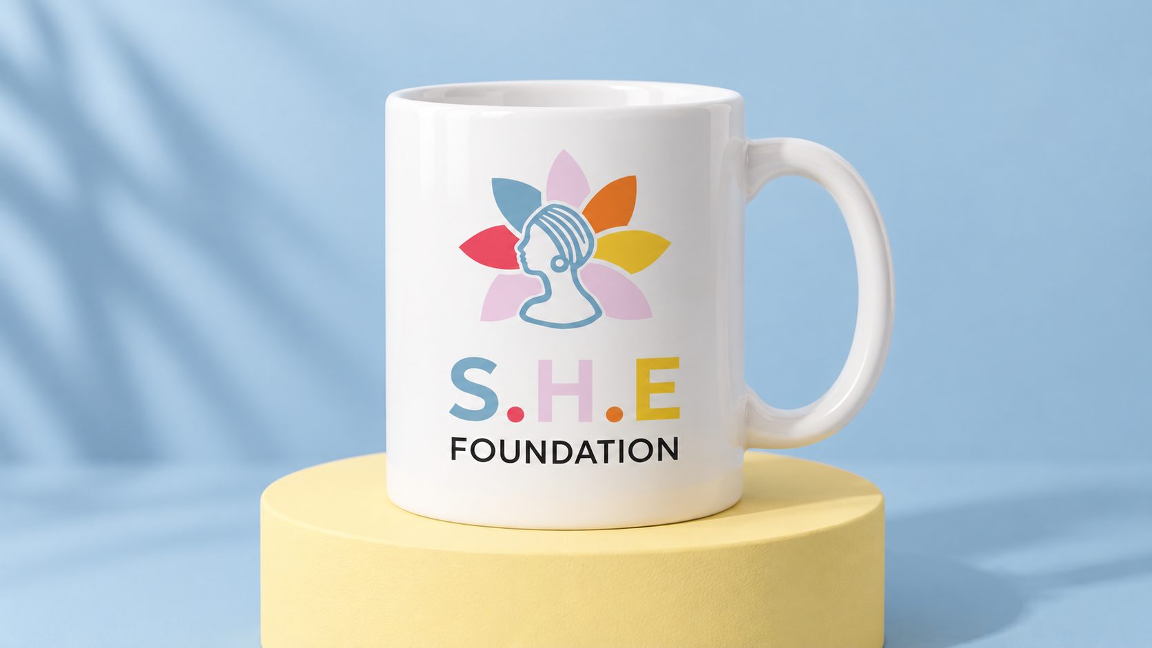 SHE Foundation concept mockup: ceramic mug